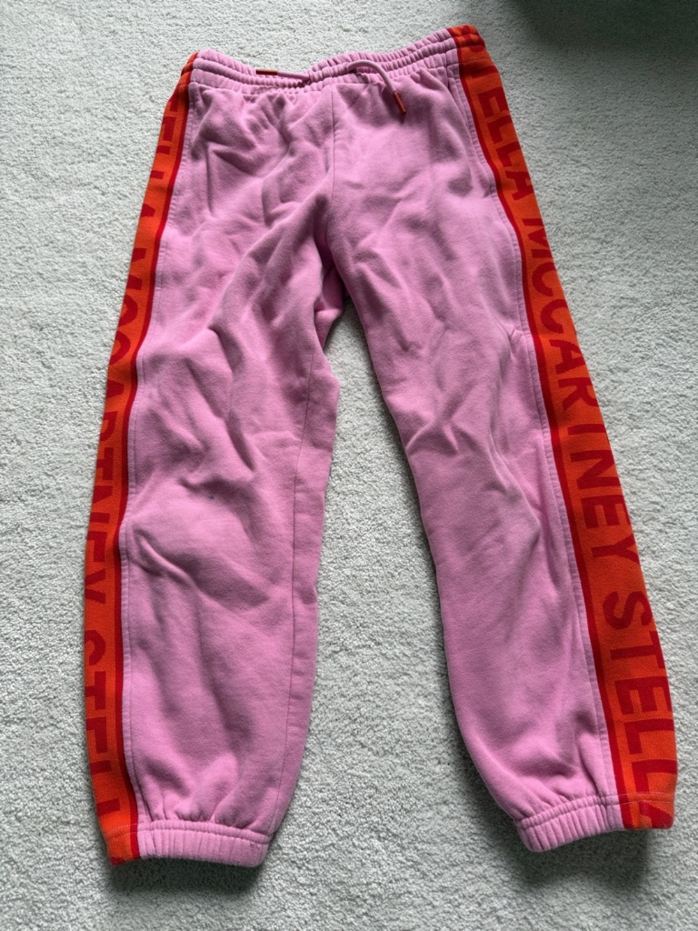 Stella McCartney Kids Pink Joggers with Orange-Red Logo Tape